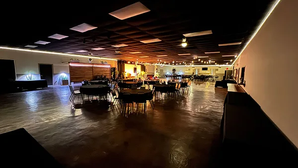 Event setup with tables and chairs in The Hall